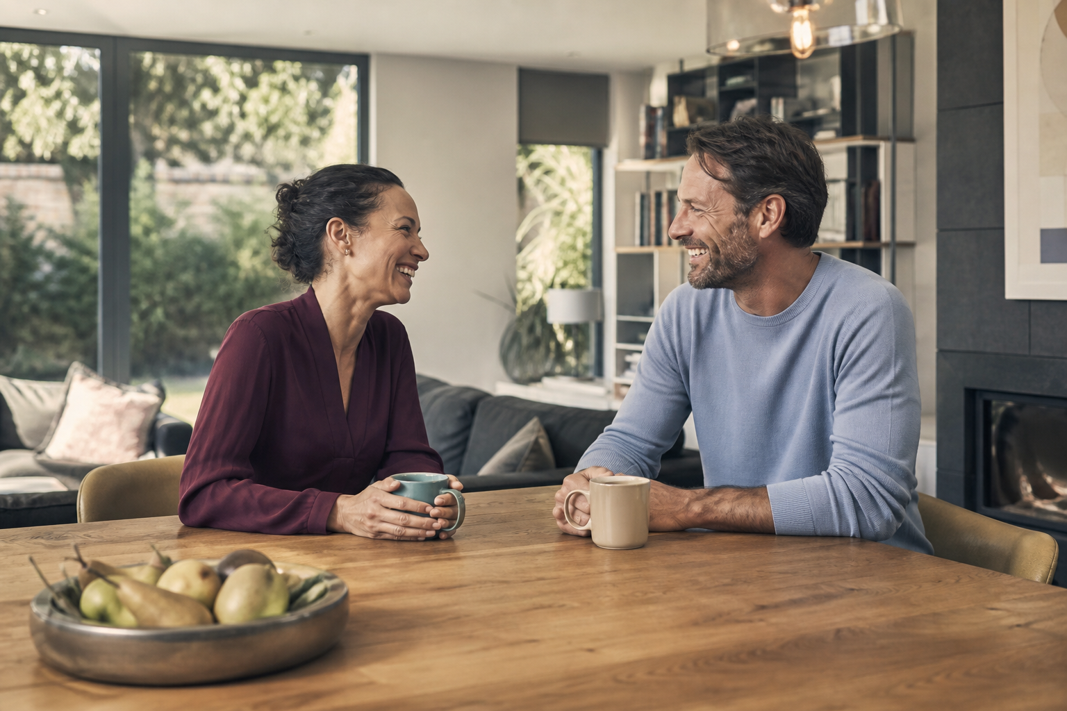 A landlord and property adviser having a relaxed conversation in a bright home