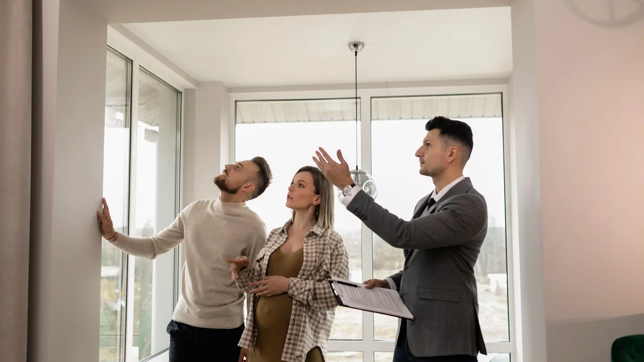 A couple viewing a home with a property professional.
