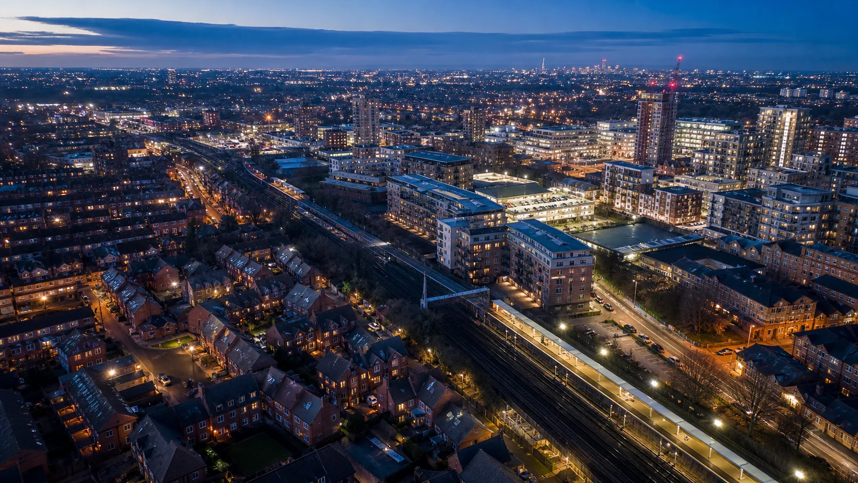 Aerial view across a Berkshire residential town at blue hour.